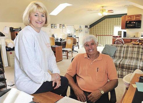 Kim Gillman Turner, left, and her father, Harry Gillman, own and operate
Tennessee Trash, a company specializing in residential, commercial,
construction and demolition waste removal.